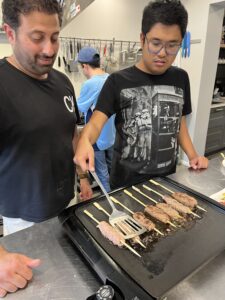 Two men cooking